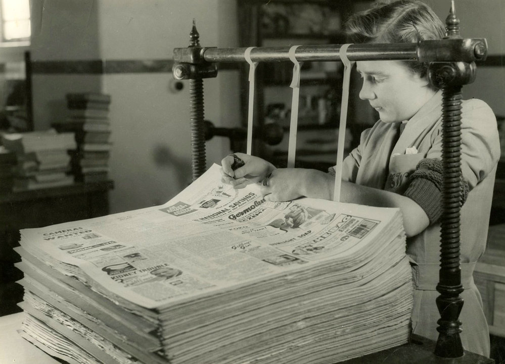 Newspapers being bound