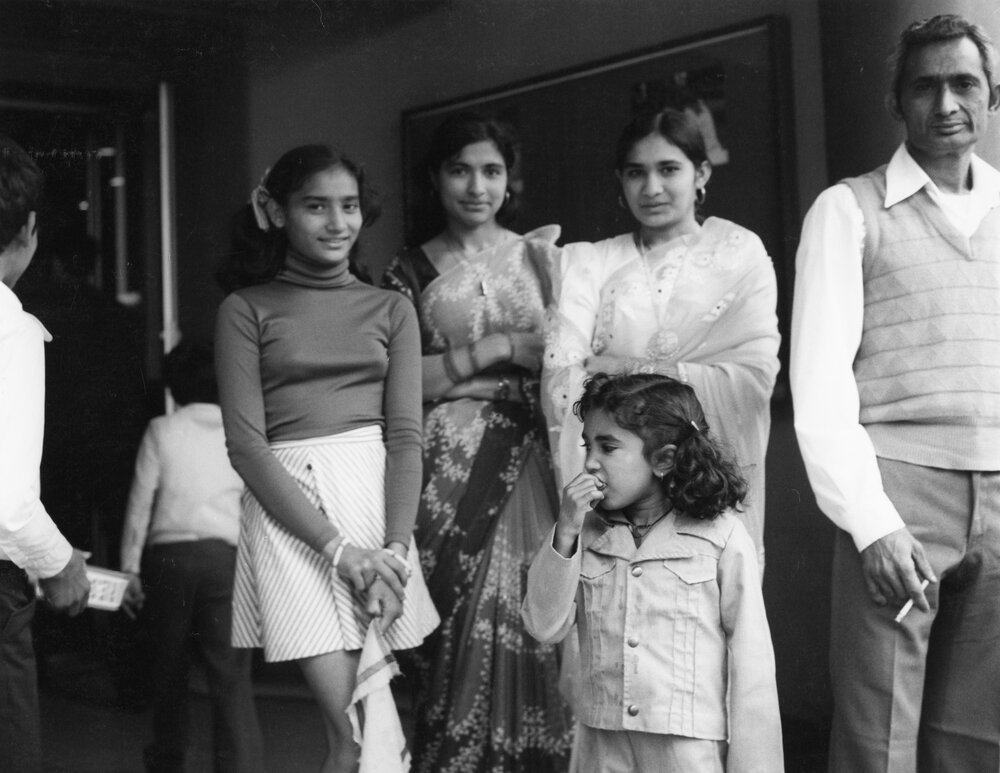 Members of the Indian community outside the Plaza Theatre 