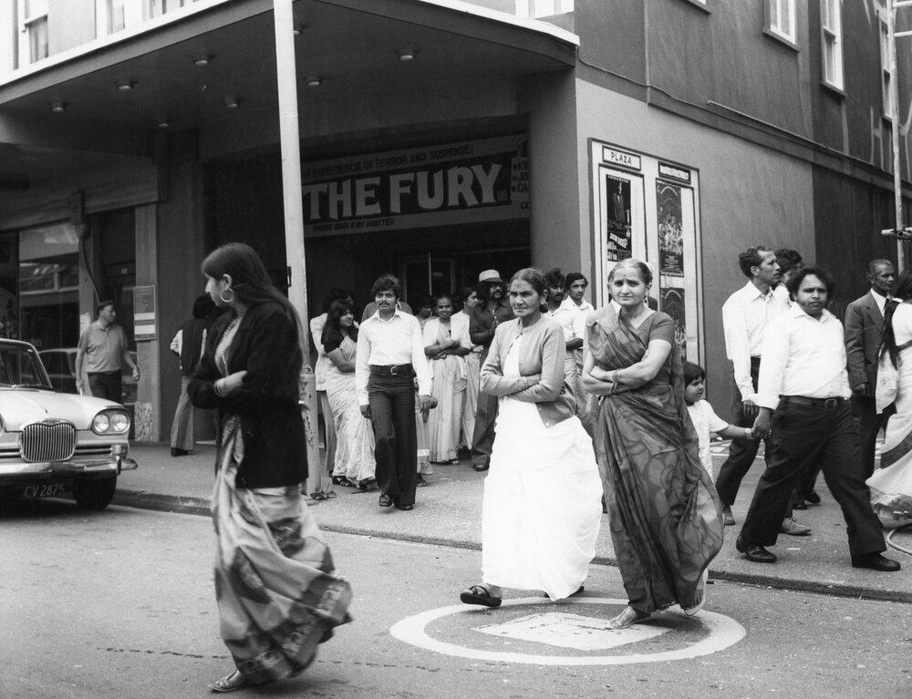 Members of the Indian community outside the Plaza Theatre