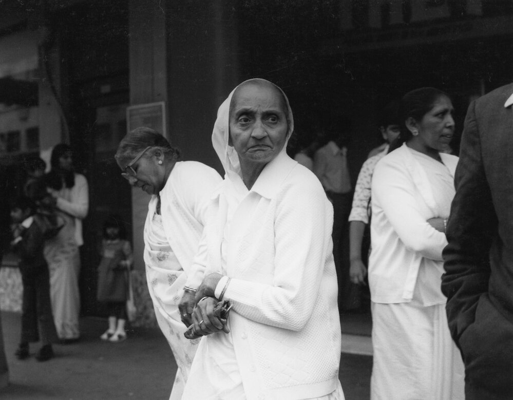 Members of the Indian community outside the Plaza Theatre