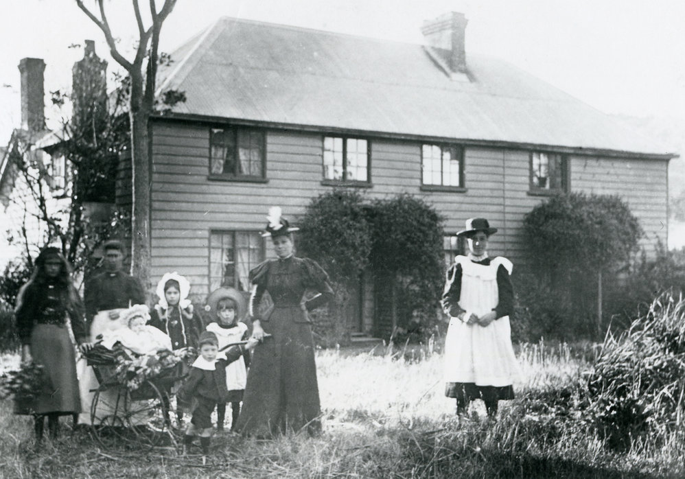 Family outside Karori Road home 