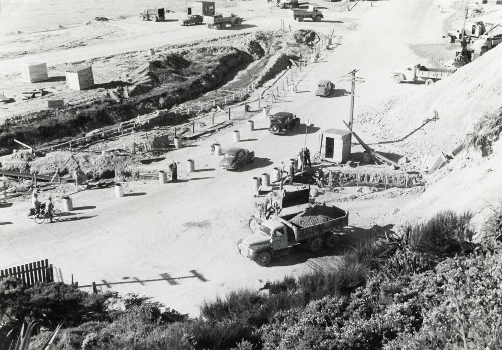 Cars passing over conveyor belt 