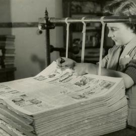 Newspapers being bound
