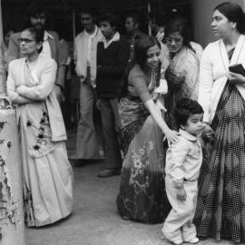 Members of the Indian community outside the Plaza Theatre
