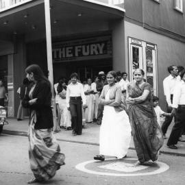 Members of the Indian community outside the Plaza Theatre