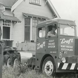 Norm Croft supervising house relocation