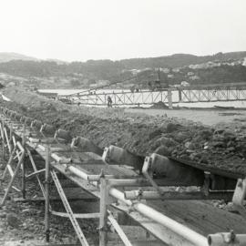 Conveyor belt moving soil