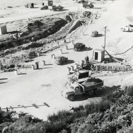 Cars passing over conveyor belt 